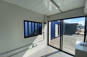 10ft shipping container site office with glass sliding door, insulation, air conditioning, electrics, flooring and window from Container Traders