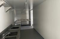 40ft shipping container modification kitchen with sinks, benches and custom shelving, insulation, electrics and lighting from Container Traders