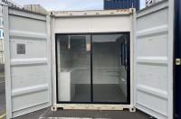 10ft shipping container converted into a site office with glass sliding doors, insulation, flooring, window, electrics and air conditioning from Container Traders