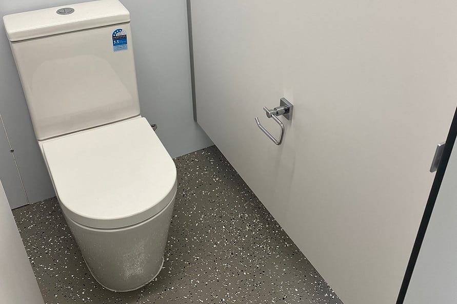 Ablution modification toilet stall in a shipping container from Container Traders