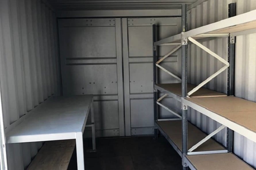 20ft shipping container modification with shelving and bench from Container Traders
